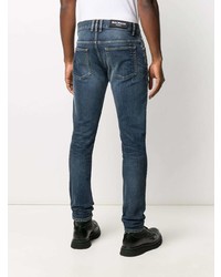 Мужские темно-синие рваные зауженные джинсы от Balmain