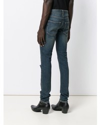 Мужские темно-синие рваные зауженные джинсы от Saint Laurent