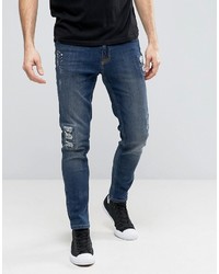 Мужские темно-синие рваные зауженные джинсы
