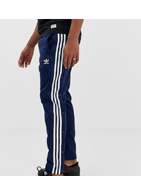 Мужские темно-синие спортивные штаны в вертикальную полоску от adidas Originals