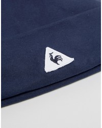 Женская темно-синяя шапка от Le Coq Sportif