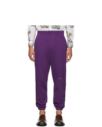 Фиолетовые спортивные штаны с принтом