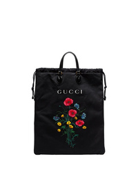 Черная большая сумка из плотной ткани с цветочным принтом