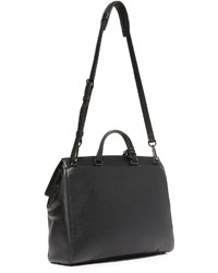 Черная кожаная большая сумка от Tumi