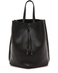 Черная кожаная сумка-мешок от Maison Margiela