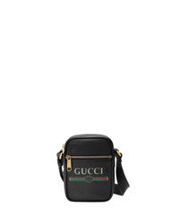 Черная кожаная сумка почтальона с принтом от Gucci