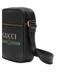 Черная кожаная сумка почтальона с принтом от Gucci