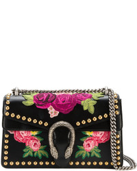 Женская черная кожаная сумка с цветочным принтом от Gucci