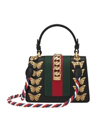 Черная кожаная сумка-саквояж с украшением от Gucci