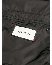 Мужская черная куртка-пуховик с принтом от Gucci