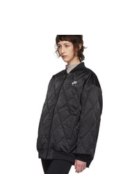 Женская черная куртка-пуховик от Nike