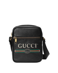 Черная сумка почтальона с принтом от Gucci