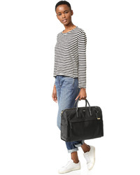 Женская черная сумка от Tumi