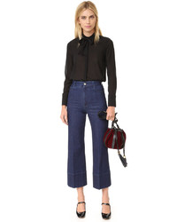 Черная шелковая блузка от Alice + Olivia