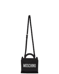 Черно-белая кожаная сумка почтальона с принтом от Moschino