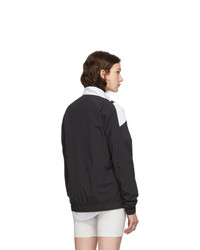 Женская черно-белая куртка-пуховик от Reebok Classics