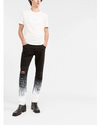 Мужские черно-белые рваные зауженные джинсы от Dolce & Gabbana