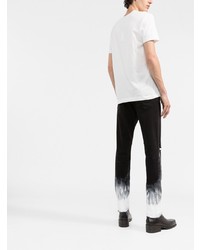 Мужские черно-белые рваные зауженные джинсы от Dolce & Gabbana