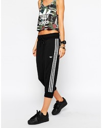 Женские черно-белые спортивные штаны в вертикальную полоску от adidas