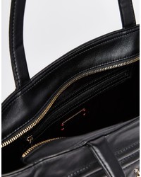 Черно-золотая кожаная большая сумка с шипами от DKNY