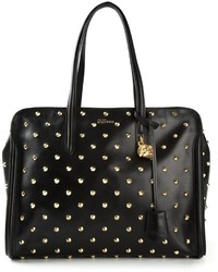 Черно-золотая кожаная большая сумка с шипами от Alexander McQueen