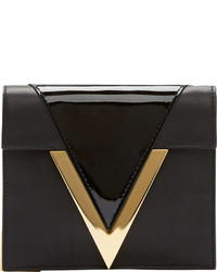 Черно-золотой кожаный клатч с украшением от Versus