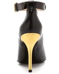 Черно-золотые кожаные туфли от Moschino