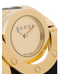 Женские черно-золотые часы от Gucci