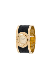 Женские черно-золотые часы от Gucci
