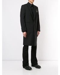 Черное длинное пальто от Undercover