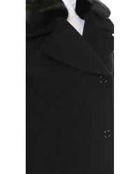 Черное пальто с меховым воротником от Acne Studios