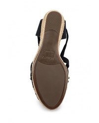 Черные босоножки на танкетке от Schutz