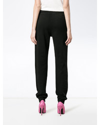 Женские черные брюки с принтом от Moschino