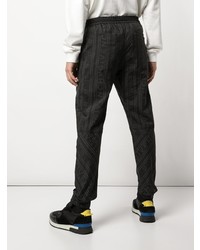 Черные брюки чинос с принтом от Givenchy