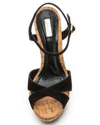 Черные замшевые босоножки на танкетке от Schutz