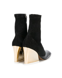 Черные замшевые ботильоны на танкетке от Neous