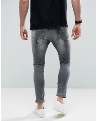 Мужские черные зауженные джинсы с принтом от Calvin Klein Jeans