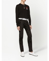 Мужские черные зауженные джинсы с цветочным принтом от Dolce & Gabbana