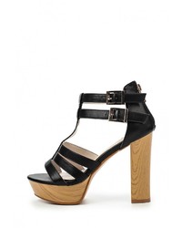 Черные кожаные босоножки на каблуке от Donna Moda