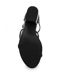 Черные кожаные босоножки на каблуке от Spurr