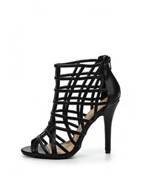 Черные кожаные босоножки на каблуке от Spurr