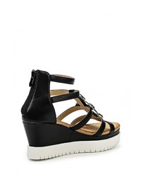 Черные кожаные босоножки на танкетке от Bellamica