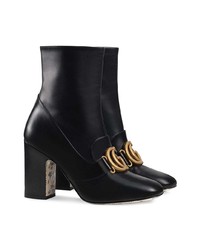 Черные кожаные ботильоны с украшением от Gucci