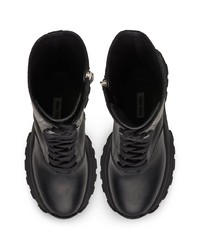 Черные кожаные массивные полусапоги от Miu Miu