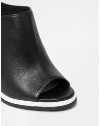 Черные кожаные сабо от Faith