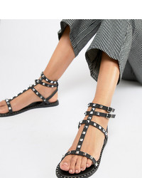 Черные кожаные сандалии на плоской подошве с шипами от Qupid
