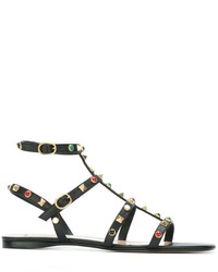 Черные кожаные сандалии на плоской подошве с шипами от Valentino Garavani