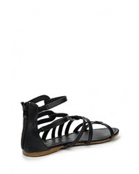 Черные кожаные сандалии на плоской подошве от Catisa