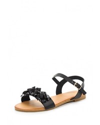 Черные кожаные сандалии на плоской подошве от Catisa