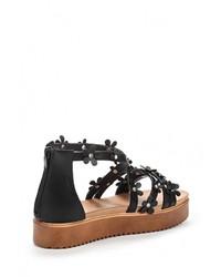 Черные кожаные сандалии на плоской подошве от Flyfor